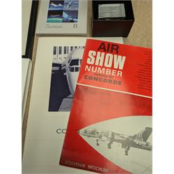 Collection of Concorde memorabilia, including paperweight, limited edition print, calendars, scale model, etc 