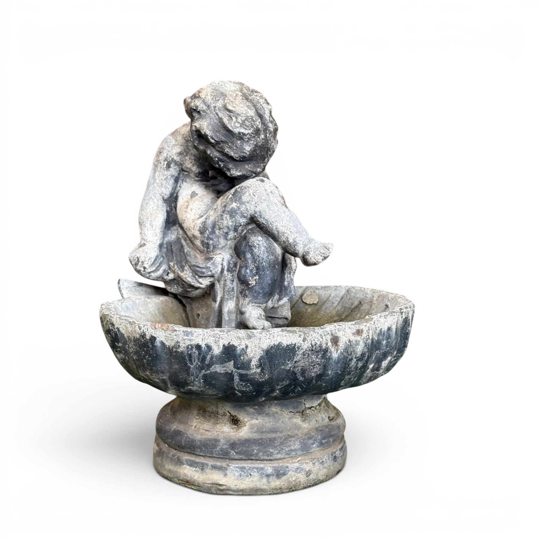 19th century lead bird bath depicting a seated cherub on a shell