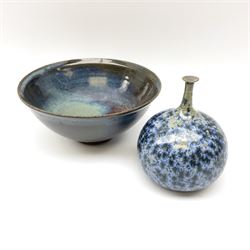 A small Studio Pottery vase, of bellied form with thin tapering neck with rim, decorated in a blue crystalline glaze, indistinctly marked beneath, H12.5cm, together with a Studio Pottery bowl decorated in and green, blue and brown high fired glaze, indistinctly marked beneath, H8.5cm D19cm.