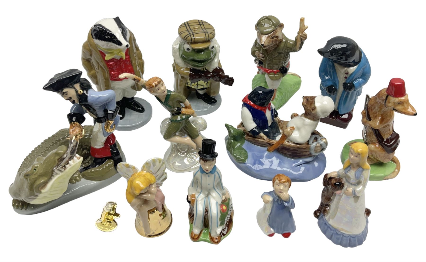 Twelve Wade Collectors Club Figures, comprising six Wind in the Willows figures; Rattie, Mole, Toad, Badger, Weasel and Rattie and Mole on the Water, Six Peter Pan figures; Captain Hook, Peter Pan, Wendy, John, Michael and Tinkerbell  