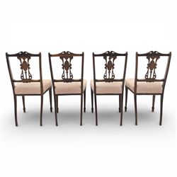 Quality Edwardian seven piece inlaid salon suite, comprising three seater settee, pair of arm chairs and four chairs with pierced splat backs, upholstered in pale pink fabric, inlaid with flowering urns, upon tapering legs with spade feet and castors