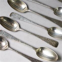 Eleven Victorian silver teaspoons, profusely engraved with floral decoration throughout with family crest to terminal, hallmarked Elkington & Co, Birmingham 1875