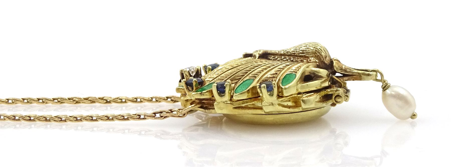  Igor Carl Faberge for Franklin Mint 14ct gold peacock watch pendant necklace, the peacock wings diamond, enamel and sapphire set, with a single suspended pearl, the back with hidden quartz watch, boxed