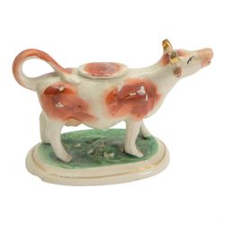 Collection of 19th century and later cow creamers, including three black glaze examples, two mottled brown examples etc  