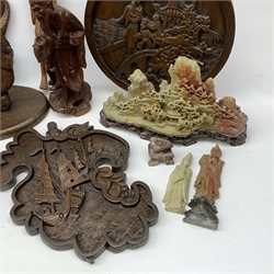  A selection of carved Eastern and African wooden figures and plaques, together with a set of five Chinese lacquer boxes, and a soapstone carving of a landscape, etc.    
