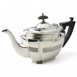 Late Victorian silver three piece tea set of panel sided oval design, the teapot with ebonised handle and lift, Chester 1898/99 Maker Florence Warden and William Aitken