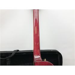 1980s Les Paul Epiphone limited edition cut-away electric guitar by Gibson, the burgundy coloured body with two pick-ups, volume and tone knobs and scratch plate, original tuning pegs, serial no.U6030215, 101cm overall; in modern Kinsman fitted carrying case