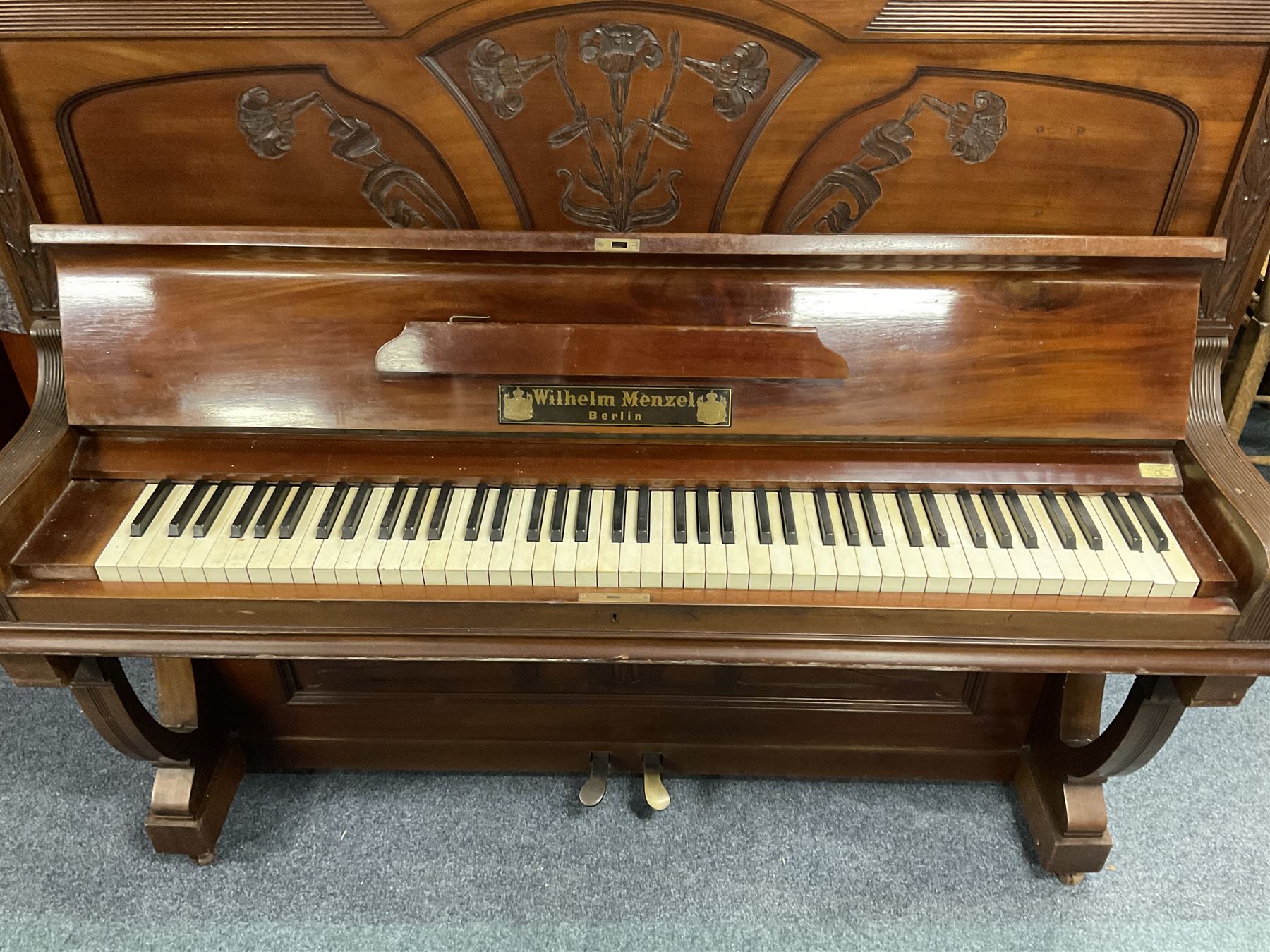 Early 20th century mahogany cast iron overstrung upright piano by Wilhelm Menzel Berlin