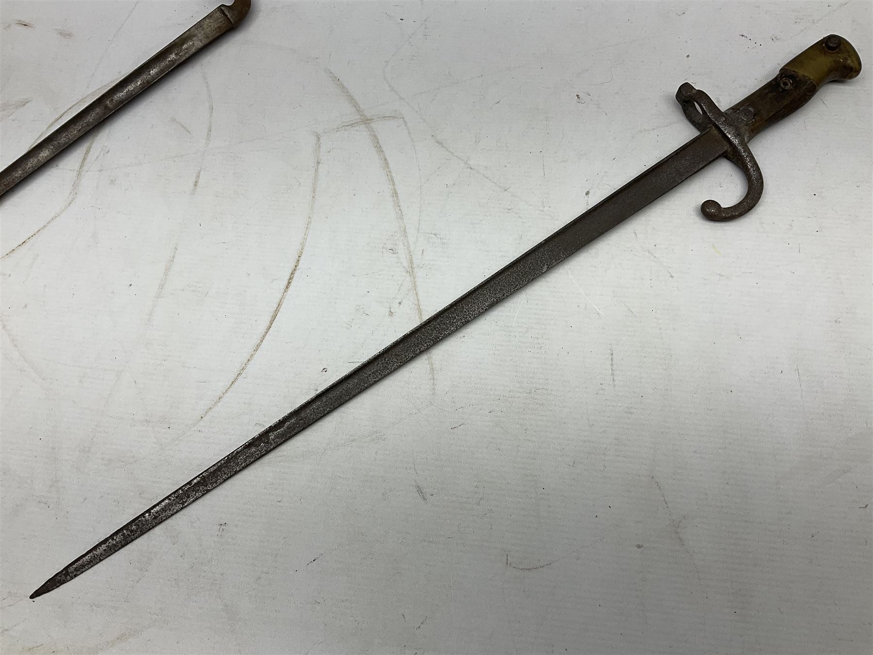 Five 19th century bayonets in relic condition without scabbards comprising British Pattern 1876 socket bayonet with Indian markings; French Model 1874 epee bayonet; and three French Model 1866 sabre bayonets (5)