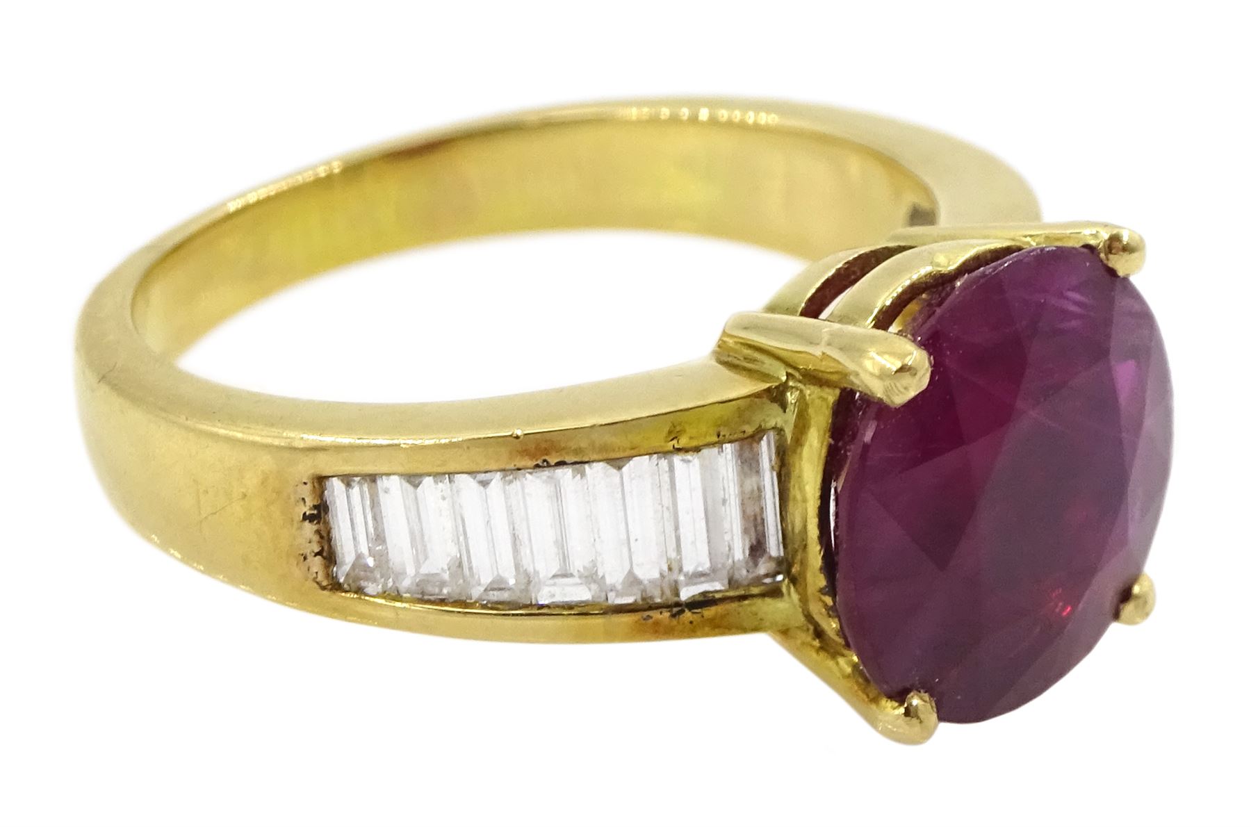 18ct gold ruby and diamond ring, single round cut ruby of approx 3.25 carat, with channel set baguette cut diamond shoulders, total diamond weight approx 0.85 carat