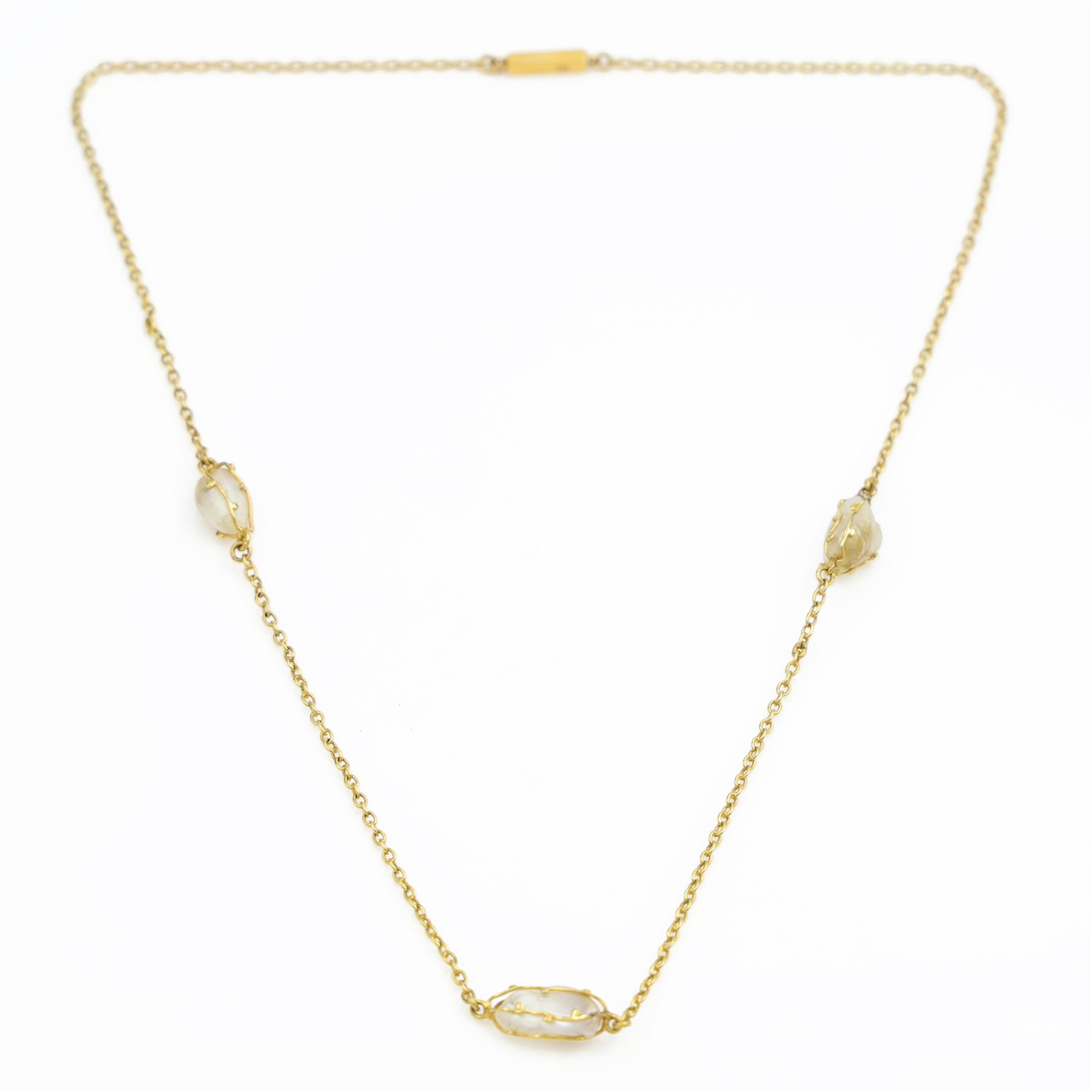 Early 20th century gold pearl necklace, three baroque pears within a wirework setting, spaced between fine belcher links and a similar 14ct gold brooch