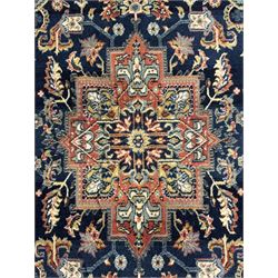 Belgian Sultan woollen ground rug, central navy field densely decorated with floral sprays and geometric patterns (192cm x 135cm); handwoven tribal terracotta ground rug (121cm x 71cm); Persian crimson ground runner, all over stylised floral and foliate motifs (266cm x 94cm)