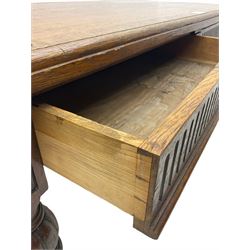 Late 19th century oak library table, moulded rectangular top with canted corners, fitted with two frieze drawers with fluted facias, on lobe carved and fluted turned supports 