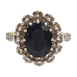  Gold sapphire and diamond cluster ring, with diamond set shoulders, stamped 10K  