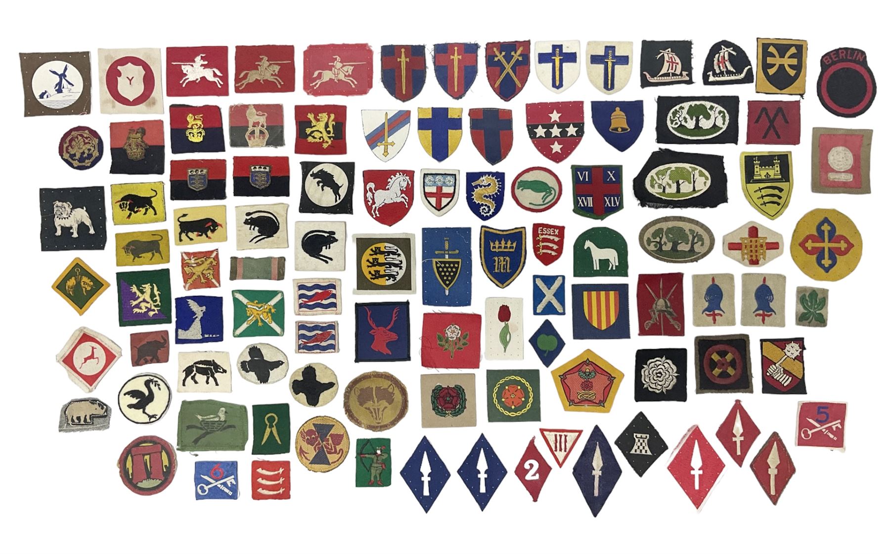 Approximately one-hundred printed and embroidered cloth badges including I, II, VIII, XI, XII and XXX Corps, Eastern Command, various Armoured Divisions, Midland, Wessex, Home Counties and 12th Infantry Brigades, Salisbury Plain, Northumberland, Hampshire, North Midland, West Riding, Essex and Suffolk Districts, Berlin & Rhine Army Troops etc