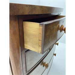Victorian mahogany bow front chest, fitted with two short and three long drawers, raised on turned supports 