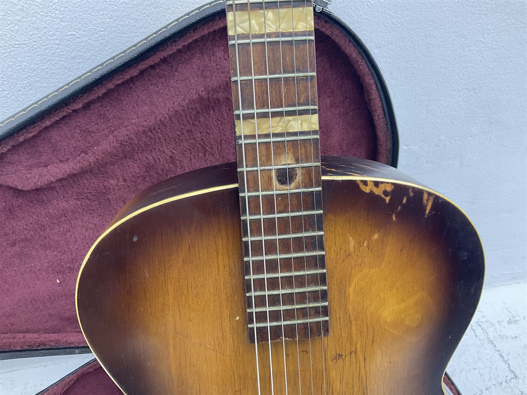 1950s Framus arch top acoustic guitar with sunburst finish and Framus logo to top, No.1937 L104cm; in hard carry case.
