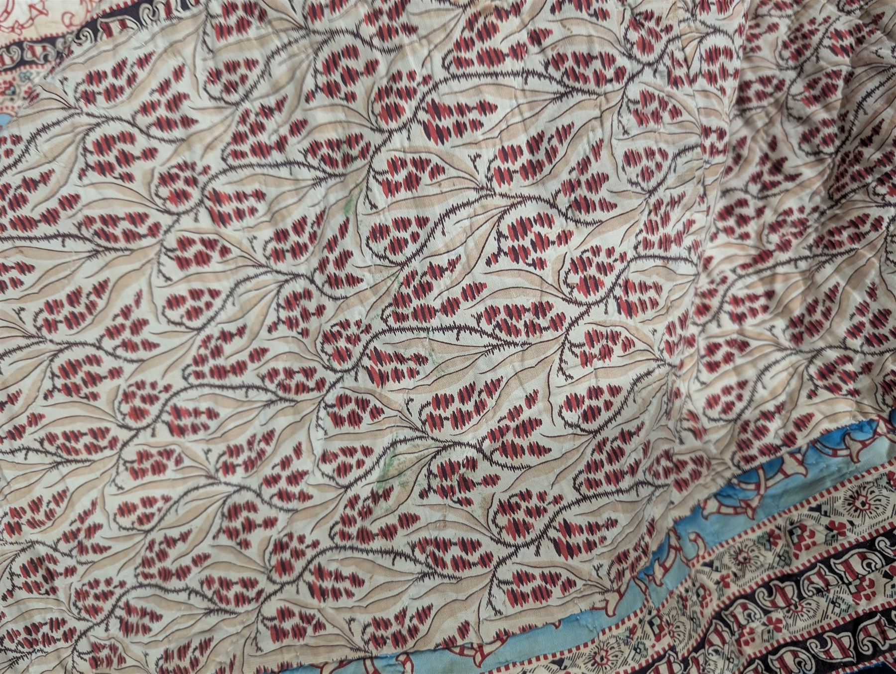 Handmade large patchwork quilt bedspread made up of individual squares of multi-coloured cottons and backed in a cream cotton, 243cm x 284cm 