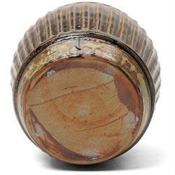 Mike Dodd (1943-): Covered studio pottery storage jar, of fluted barrel form, impressed marks to foot, H20cm 