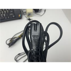 Sinclair ZX Spectrum (1984) with accessories and games; ten games for Sinclair Spectrum and 48K Spectrum to include ‘Knight Lore’, ‘The Way of the Exploding Fist’, and ‘Green Beret’ all in original boxes, ‘Rambo First Blood Part II’ without original box; Sinclair UK1400 Power Supply Unit, Hales Universal Mains Adapter, RAM Turbo Spectrum Joystick Interface, Starlite Cassette Player, all without boxes