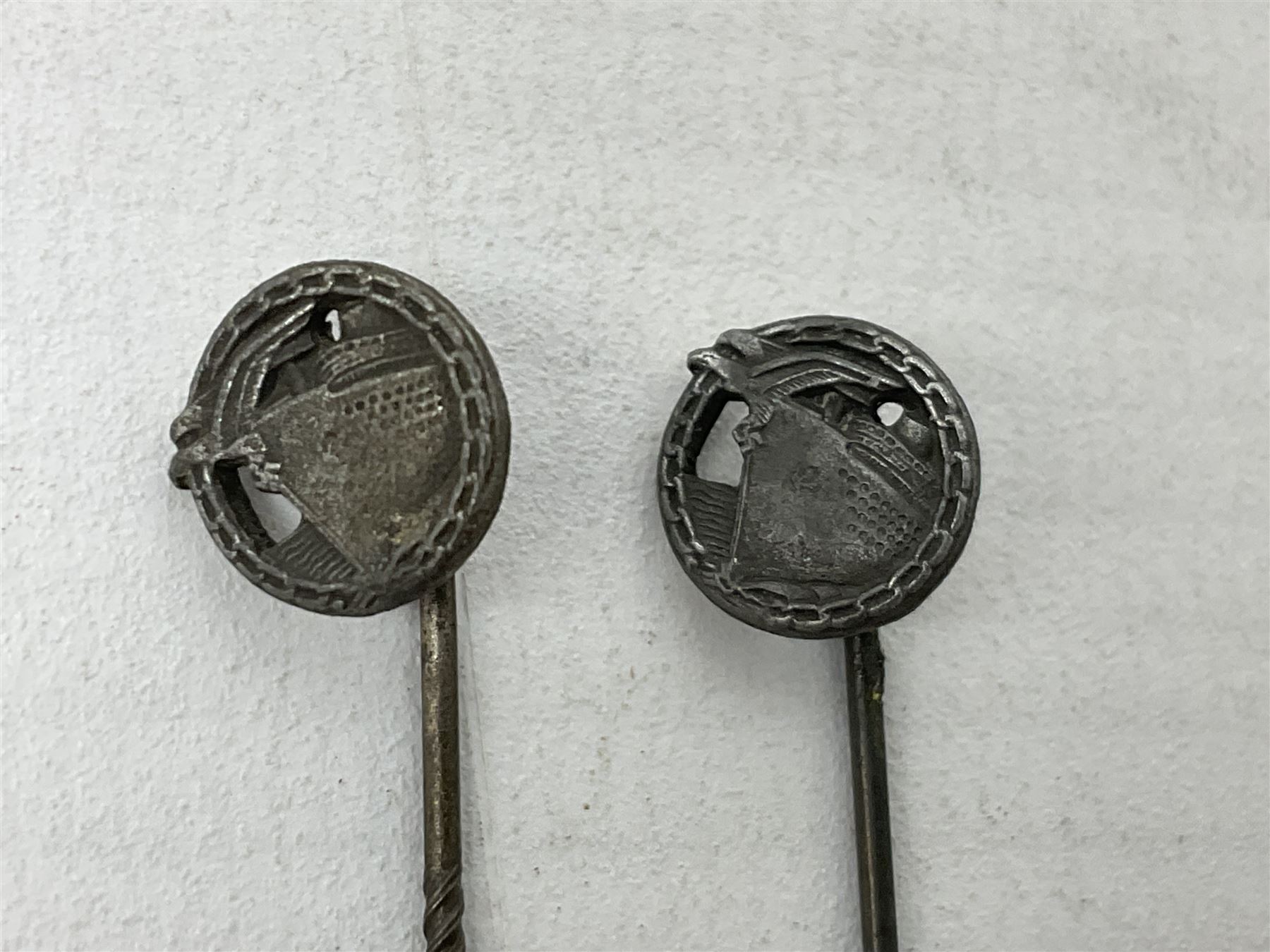 Nine WW2 German lapel pins including five Infantry Assault, Tank