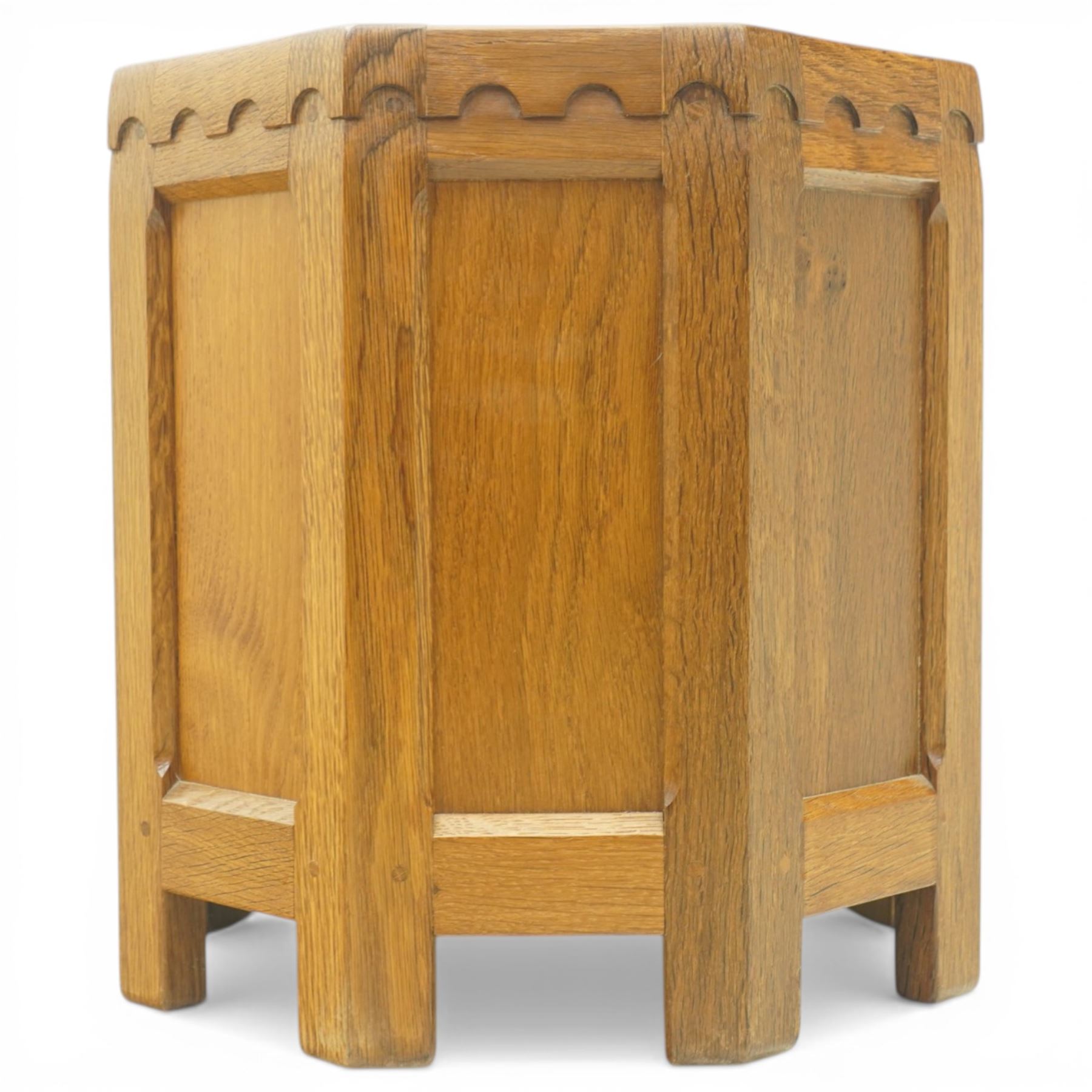 Mouseman - octagonal oak planter or log bin, with contrasting fumed oak panels, penny moulded top, with a cylindrical removable steel bucket, on eight short legs, with carved mouse signature, by the workshop of Robert Thompson of Kilburn, with 1997 original purchase receipt