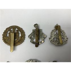 Twenty cap badges including Hertfordshire, Royal Sussex, Cambridgeshire, Hampshire, Notts and Derby, East Surrey, Herefordshire, South Lancashire, Devonshire, Bedfordshire, Durham Light Infantry etc (20)