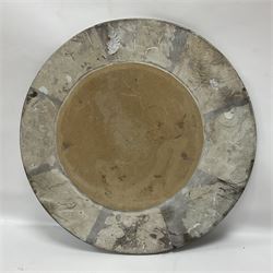 Circular limestone table top, with orthoceras and goniatite inclusions; age: Upper Devonian, location: Morocco, D45cm