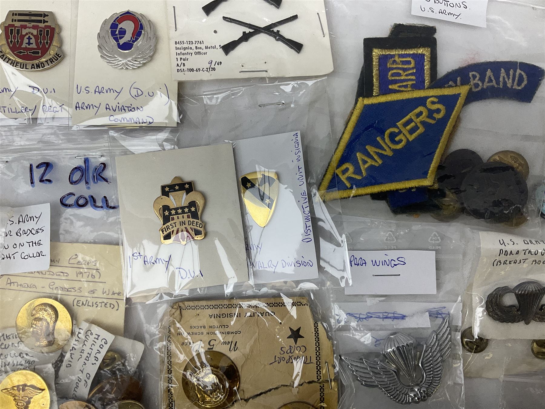 American patches and badges, including para wings, USS Constellation, Strategic Air Command, U.S. military academy, health service regt, Navy Seals, Air Defence Command, Seventh Fleet, various collar badges etc