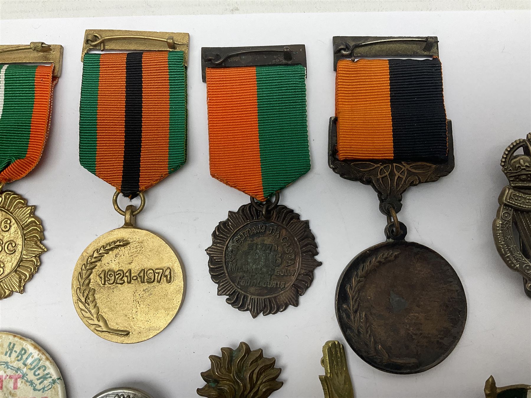 Small collection of Irish related medals, cap badges, buttons, political pin badges etc