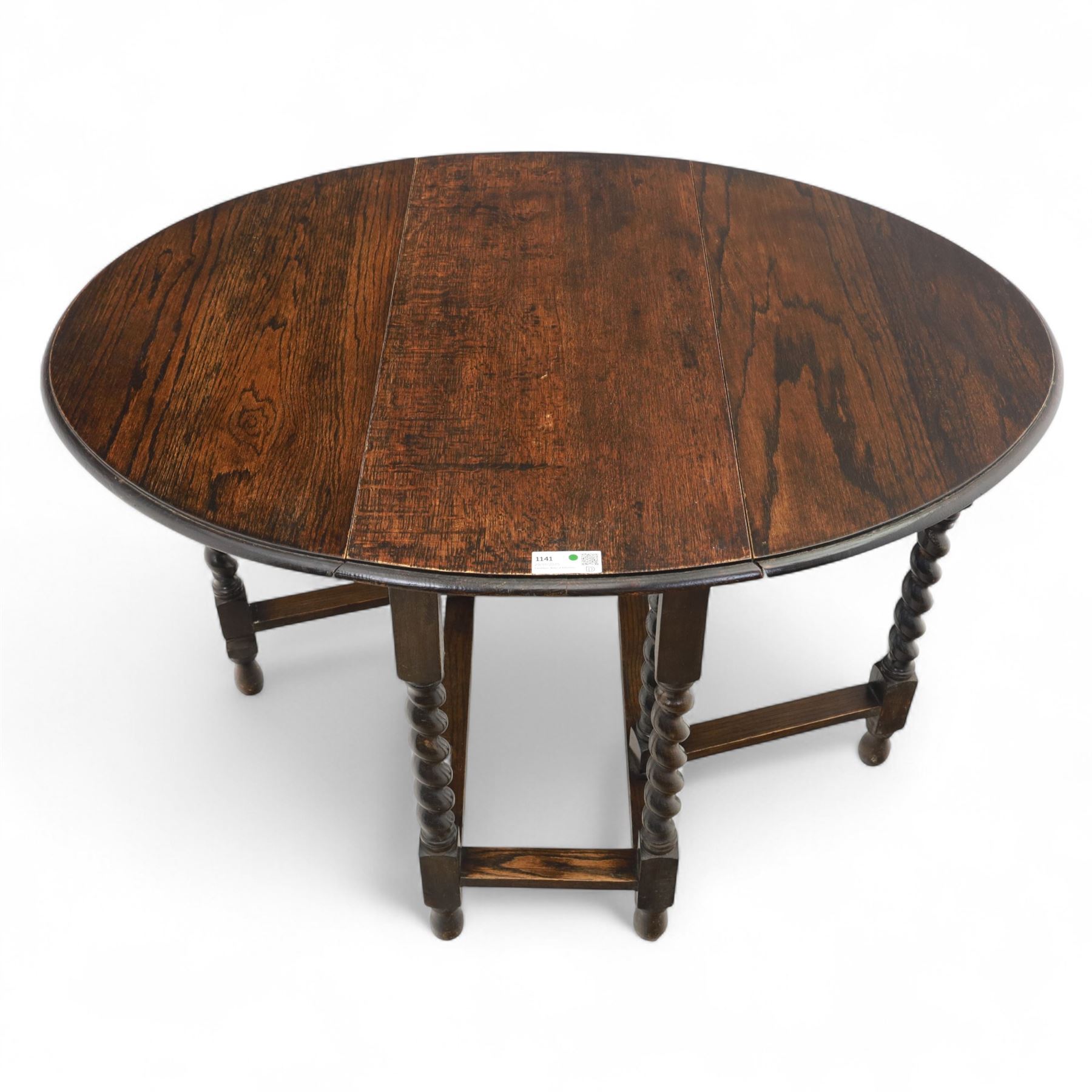 20th century oak gateleg table, with oval fold-out top supported on turned barley twist legs and stretchers (Extended 116cm)