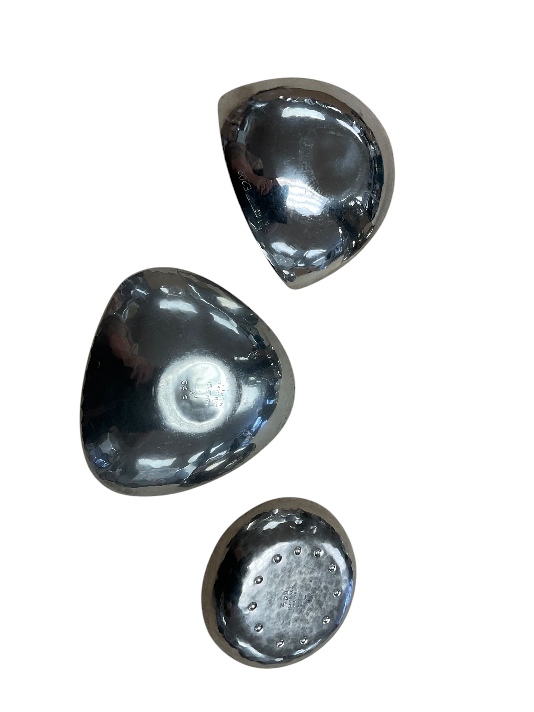 Keswick school of art hammered with fluted rim, together with three Keswick dishes 