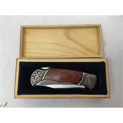 Norwegian Brusletto Geilo hunting knife with 10cm single edged blade, alloy and leather grip; in decorative leather sheath L23cm overall; modern ornate folding knife in box; and 19th century steel rabbit gin trap, having 10cm rectangular serrated jaws and iron stake on chain (3)