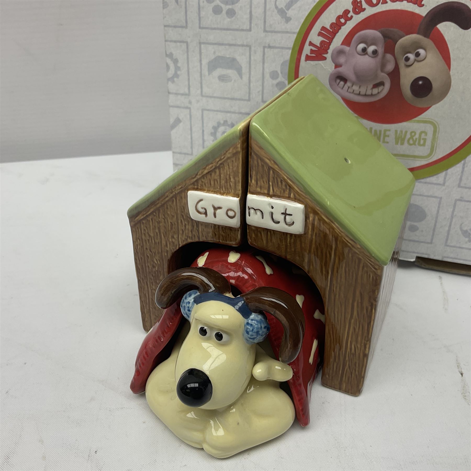 Border Fine Arts Shaun The Sheep Tractor Train and musical figure, together with a Wallace and Gromit photograph frame and a Gromit cruet sett, three in original boxes  