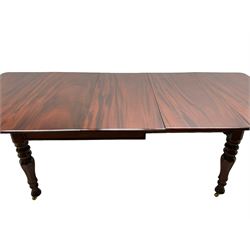 19th century mahogany extending dining table with three additional leaves, rectangular top with rounded corners, pull-out action, on turned and faceted supports with brass castors