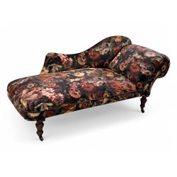 Victorian hardwood-framed chaise longue, serpentine back with rolled arm, upholstered in floral pattern fabric, on ring turned legs with ceramic castors 