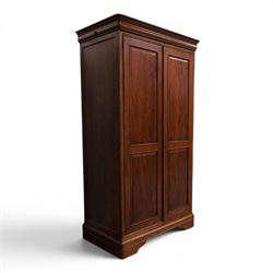 Willis & Gambier - mahogany bedroom wardrobe, projecting cornice with two additional rails, panelled doors with trouser rack and blue baize trinket, enclosing a shelf above a wooden clothes rail and shoe rack, raised on bracket feet 
