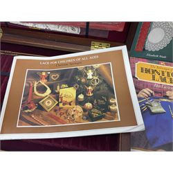 Collection of lace making wooden bobbins, together with lace making books and a handmade storage box