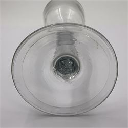 Three 18th century wine glasses comprising a plain stemmed glass with bell shaped bowl and conical folded foot H16cm, another plain stemmed glass with ogee bowl and folded foot and a Continental glass with gilt faceted bowl, decorated with male figure within a landscape, on a clear Silesian seven sided cut stem (3)