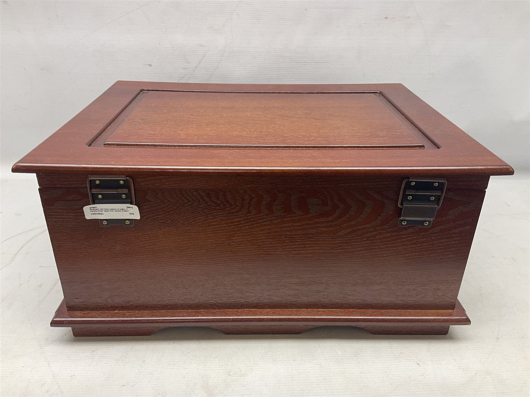 Waltmann und Sohn part canteen of stainless steel and gilt cutlery, the stained wood case with hinged lid above two fitted drawers, L48cm