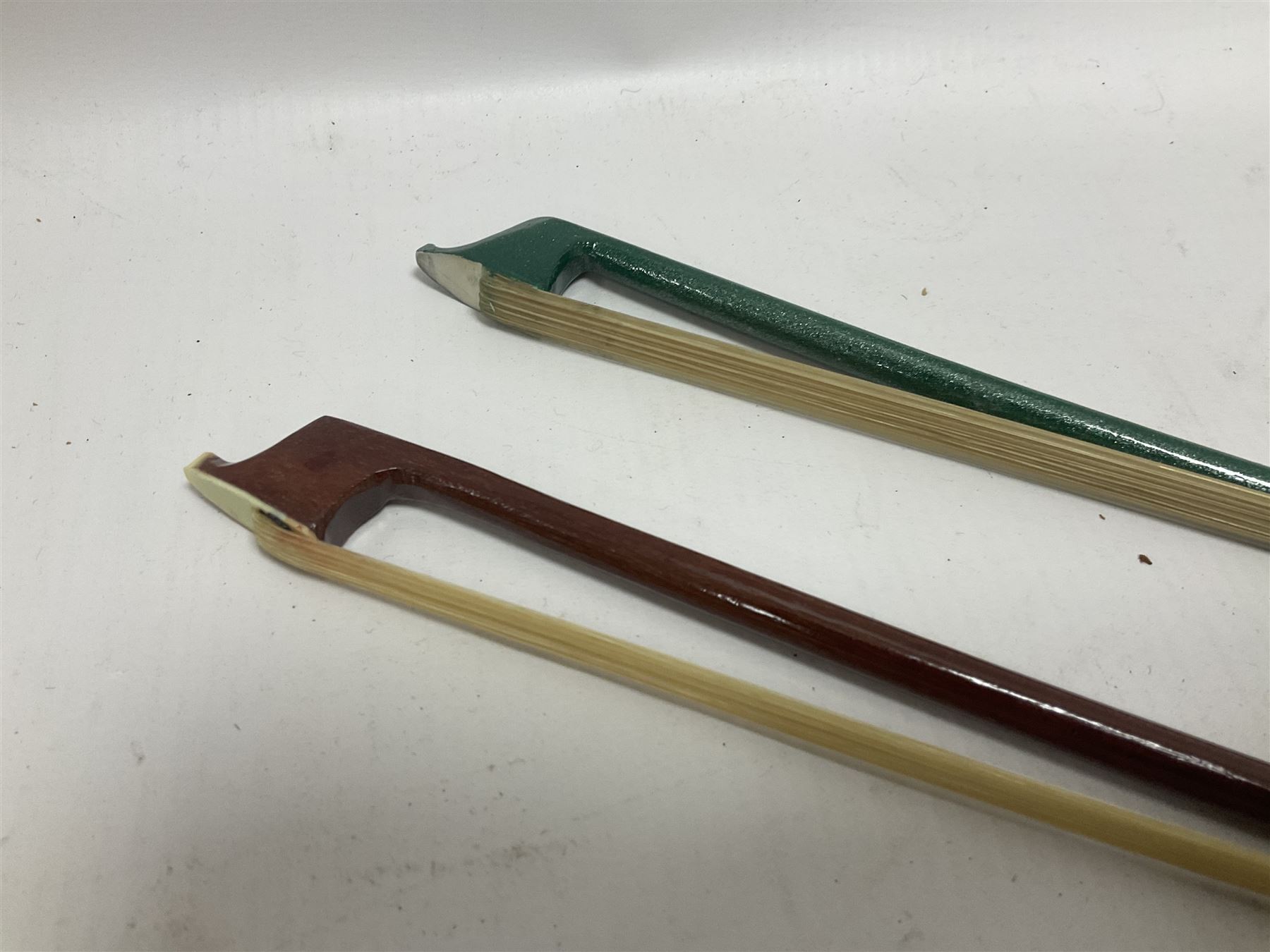 Zest full size pink violin, with a solid wood body and maple head, with matching pink bow and two further bows, in a hard case Length 60cm