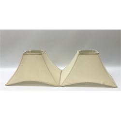 Pair Oriental table lamps decorated with birds in a tree with fruit, on a red ground with a gilded base together with cream lampshades H57cm, without lampshade. 