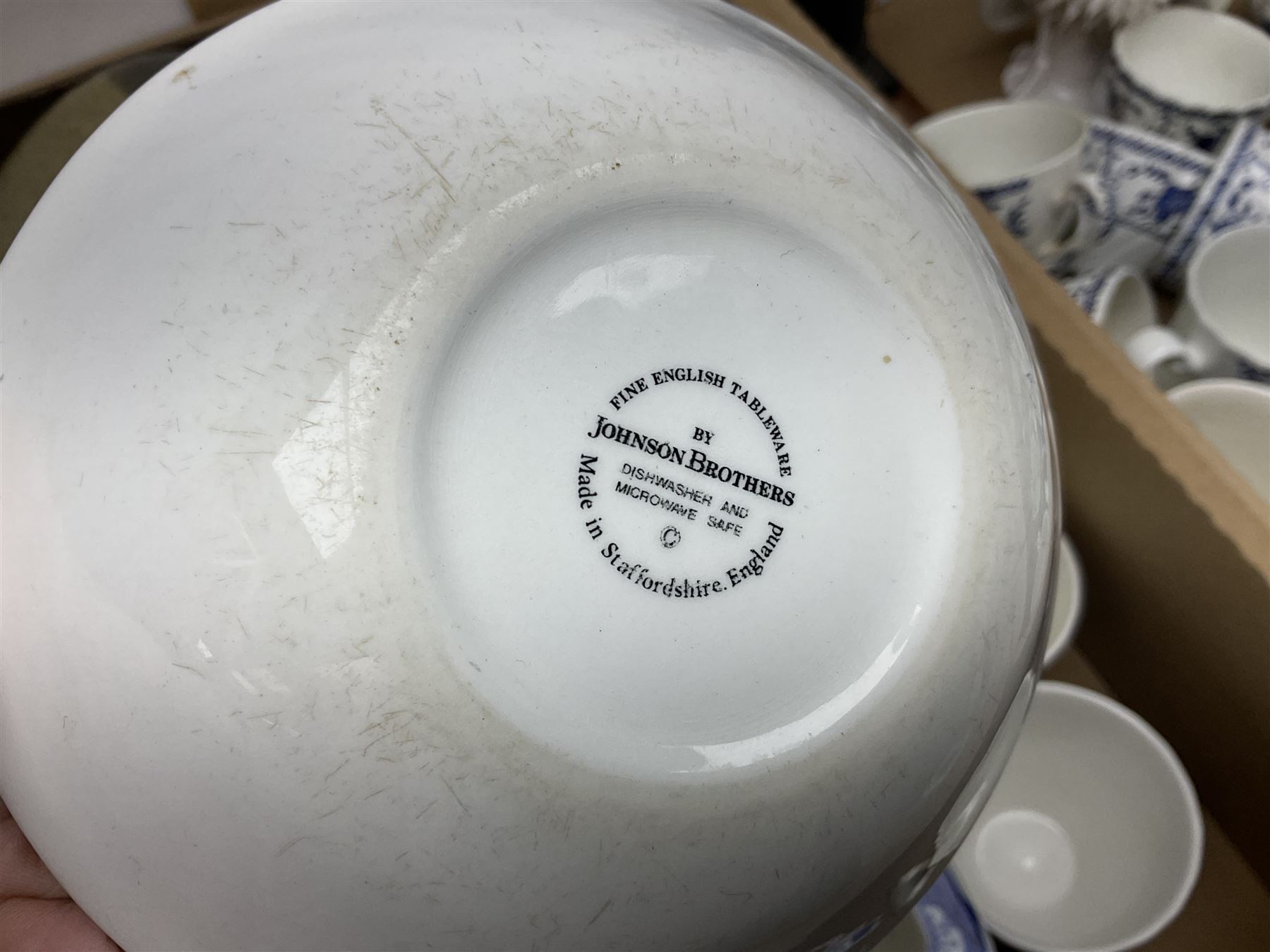 Johnson Bros Indies pattern tea and dinner wares, painted metal female bust on wooden plinth, three radios including one Roberts, Zenit B camera body, Polaroid 1000 land camera, Lorus wristwatch, and other ceramics etc, in four boxes