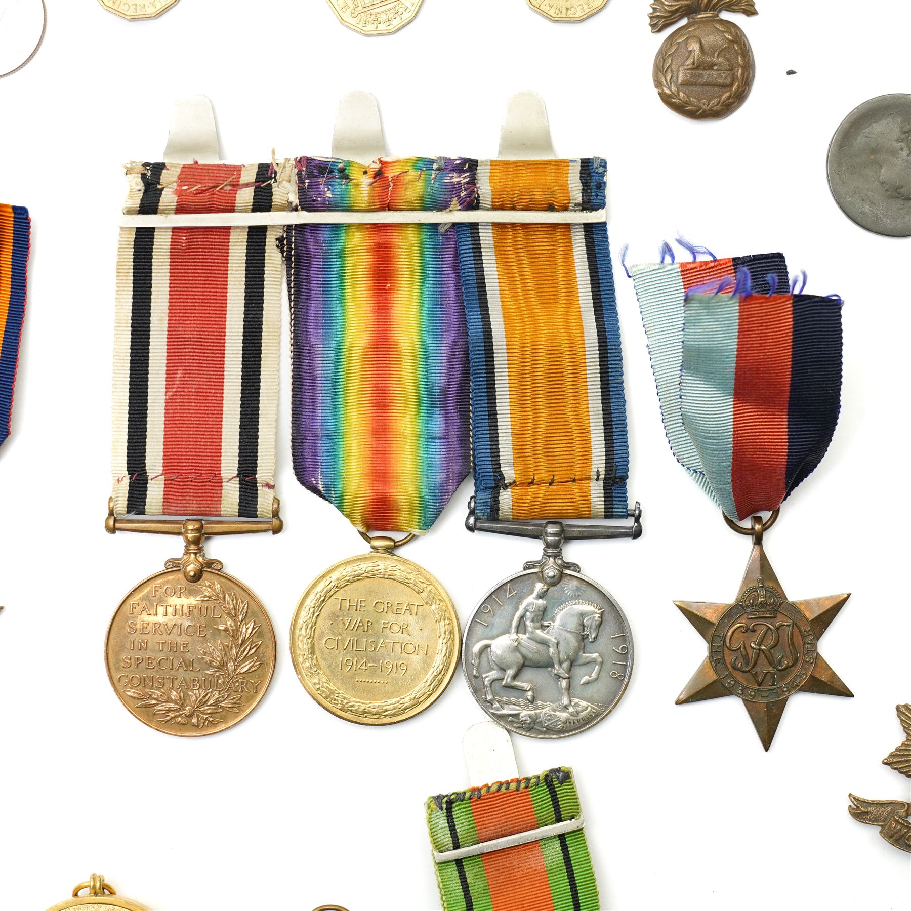 World War I trio to 118150 Gnr H E Ashfield R.A. comprising War medal, Victory medal and George VI Special Constabulary medal,  WWII Burma Star, 1939-1945 Star and Defence medal, military badges, assorted coins etc
