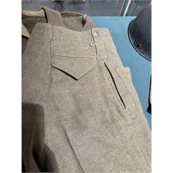 WWII British parachute regiment battle dress uniform, the jacket with shoulder title and Pegasus formation badge to the left arm, shoulder title, Pegasus formation badge and cloth wings to the right, size 3 dated 1943, the trousers size 3 dated 1945 