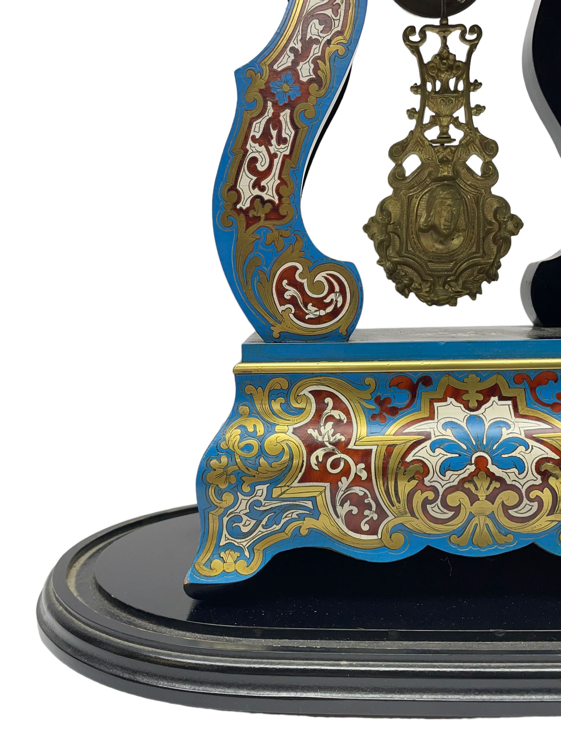 Breguet A Paris - Mid-19th century 8-day French portico clock, ebonised case with brass and cloisonne inlay, on a rectangular plinth with a shaped base, white enamel dial with blue Roman numerals, minute track and steel trefoil hands, cast brass bezel with scroll and foliate decoration and a conforming gridiron pendulum, twin train going barrel movement with a countwheel strike sounding the hours and half-hours on a bell, with an ebonised base and glass dome. 