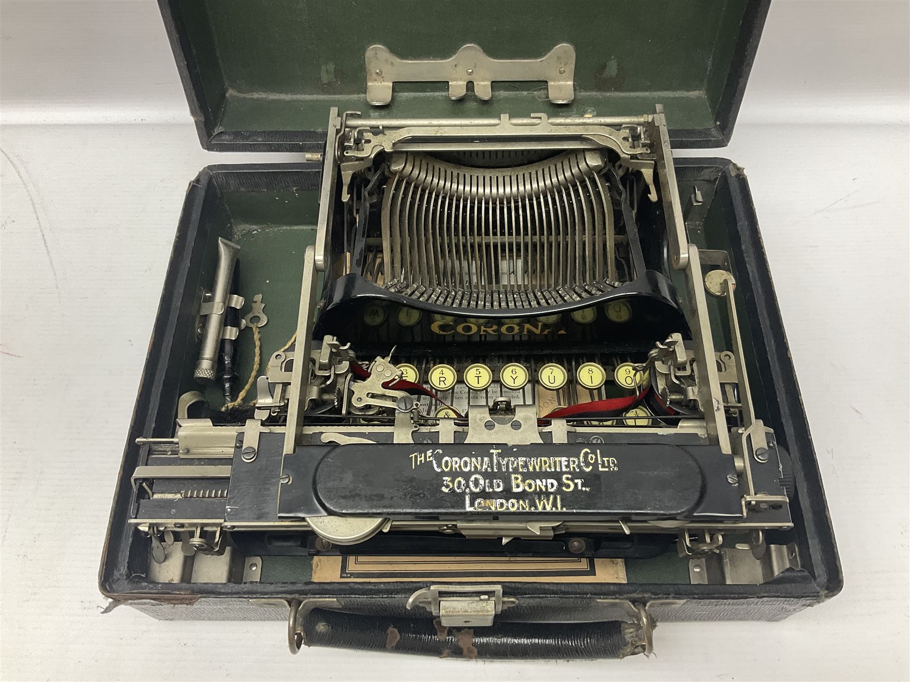 Corona typewriter in case, together with a grey angle pose style lamp