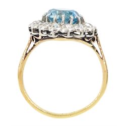 Early 20th century 18ct gold round cut blue zircon and old cut diamond cluster ring, zircon approx 3.35 carat, total diamond weight approx 1.10 carat