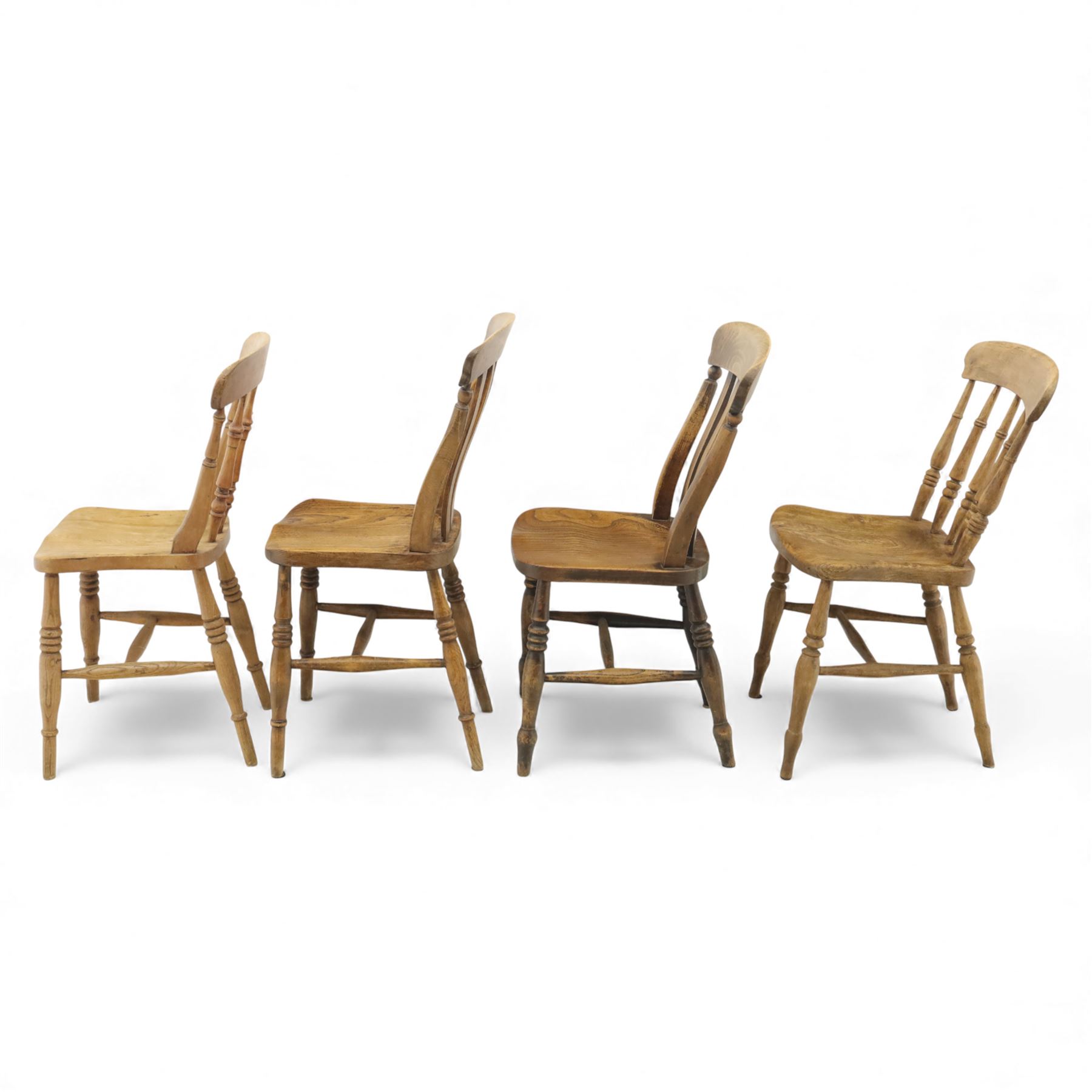Eight Victorian farmhouse chairs in elm and beech, spindle-back frames with moulded seats, on turned and plain supports