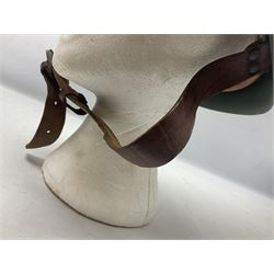 1960s Italian parachutist helmet with liner; camouflage paintwork with parachutist crest to the front